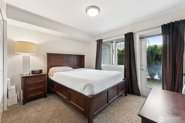 13405 97th Ave E Unit 107, Puyallup, WA 98373 - bedroom featuring light carpet and access to outside