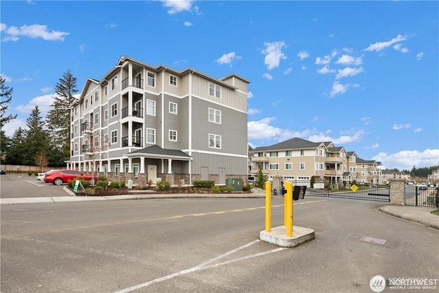 13405 97th Ave E Unit 107, Puyallup, WA 98373 - view of building exterior with fence