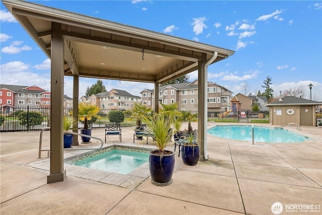 13405 97th Ave E Unit 107, Puyallup, WA 98373 - community pool with a patio, a residential view, fence, a hot tub, and an outbuilding