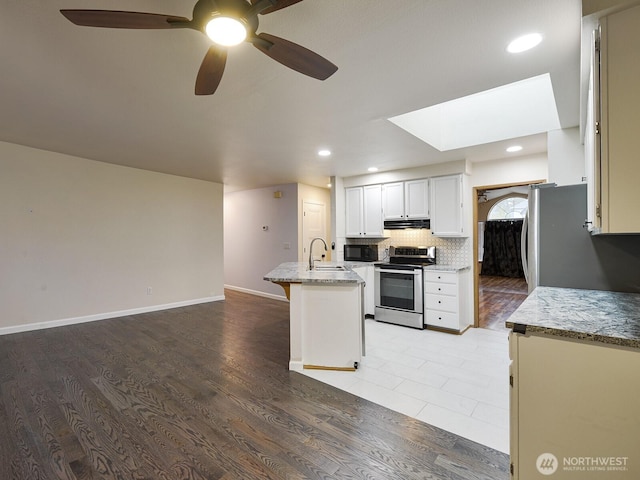 1307 SW 355th Pl, Federal Way, WA 98023 - kitchen with stainless steel electric range oven, range hood, a sink, ceiling fan, and black microwave