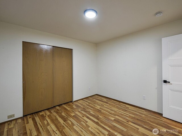 1307 SW 355th Pl, Federal Way, WA 98023 - unfurnished bedroom with wood finished floors and a closet