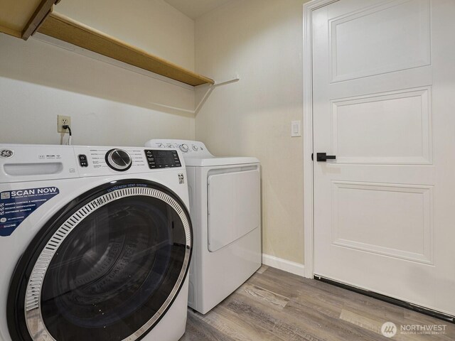 1307 SW 355th Pl, Federal Way, WA 98023 - clothes washing area featuring washing machine and dryer, light wood finished floors, and baseboards