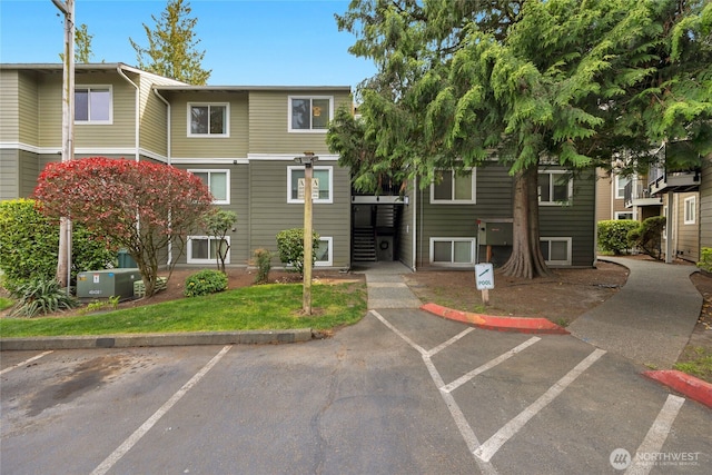 view of property with uncovered parking