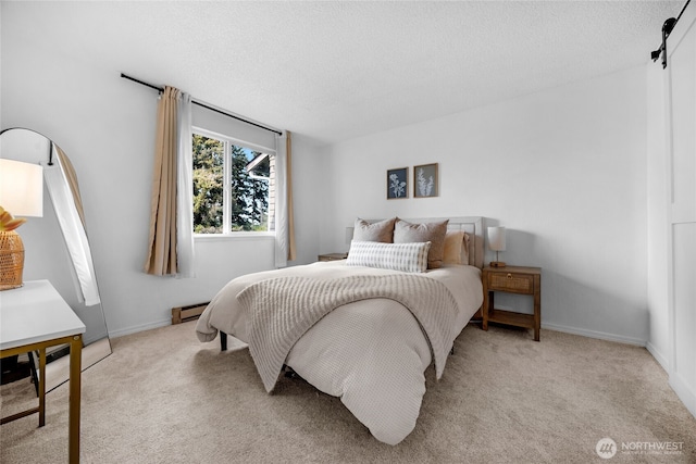 bedroom featuring baseboard heating, carpet flooring, a textured ceiling, and baseboards