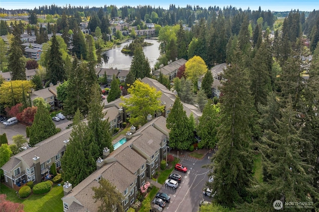 aerial overview of property's location featuring nearby suburban area and a nearby body of water