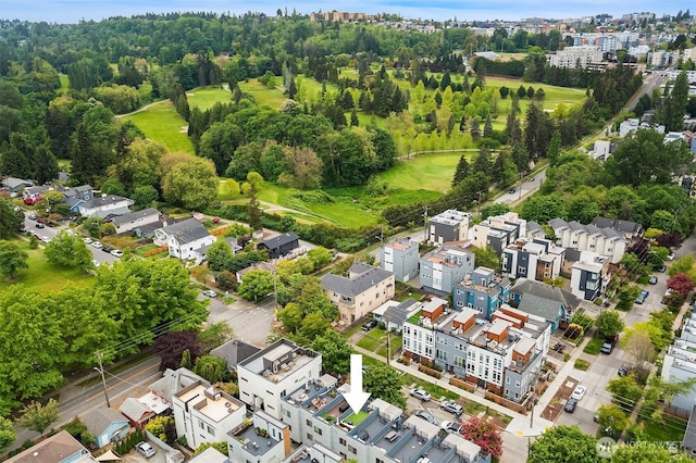 aerial perspective of suburban area featuring a golf course