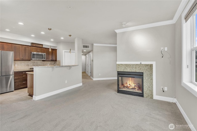 15408 Main St Unit 401, Mill Creek, WA 98012 - unfurnished living room with light colored carpet, crown molding, baseboards, recessed lighting, and a multi sided fireplace