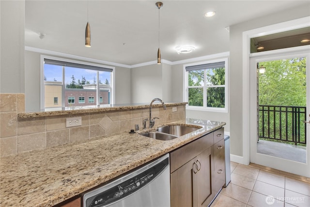 15408 Main St Unit 401, Mill Creek, WA 98012 - kitchen with stainless steel dishwasher, a sink, ornamental molding, healthy amount of natural light, and light tile patterned flooring