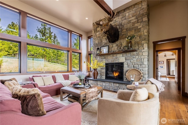 40 Eagle Ridge Dr, Cle Elum, WA 98922 - living area with a fireplace, hardwood / wood-style flooring, a towering ceiling, recessed lighting, and beamed ceiling