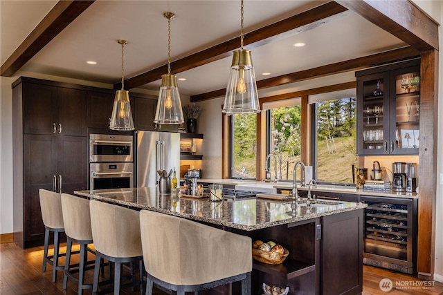 40 Eagle Ridge Dr, Cle Elum, WA 98922 - indoor wet bar featuring wine cooler, beamed ceiling, stainless steel appliances, dark wood-style flooring, and decorative light fixtures