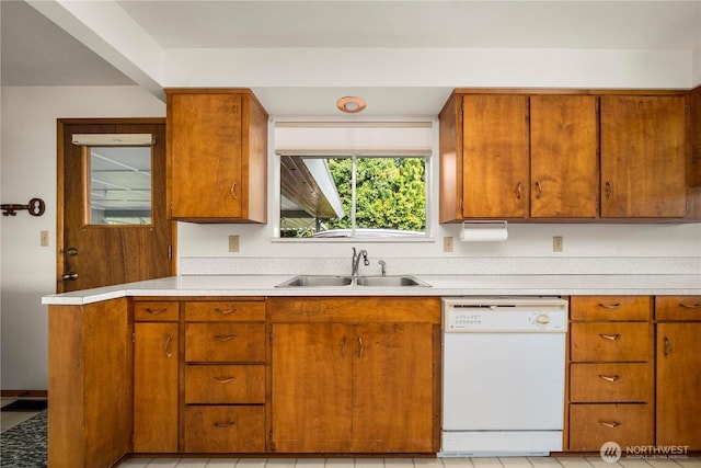 4414 Merlie Ave NE, Bremerton, WA 98310 - kitchen with dishwasher, a sink, light countertops, and brown cabinets