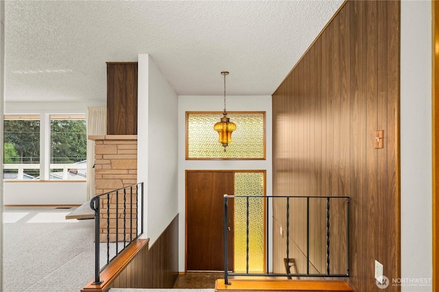 4414 Merlie Ave NE, Bremerton, WA 98310 - entrance foyer featuring a textured ceiling and wooden walls