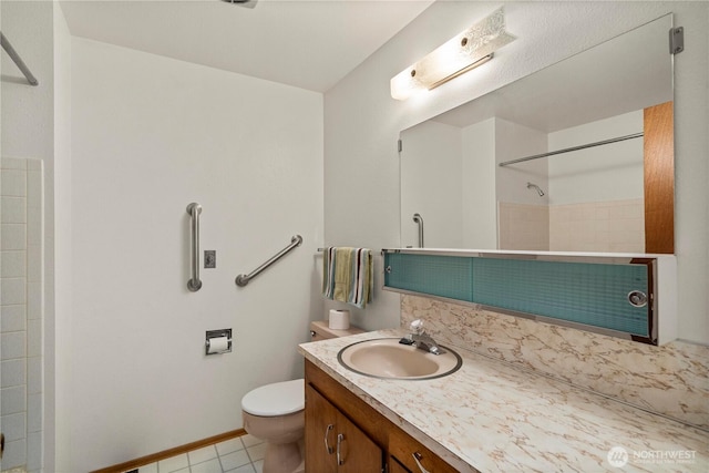 4414 Merlie Ave NE, Bremerton, WA 98310 - full bathroom featuring toilet, a shower, vanity, baseboards, and tile patterned flooring