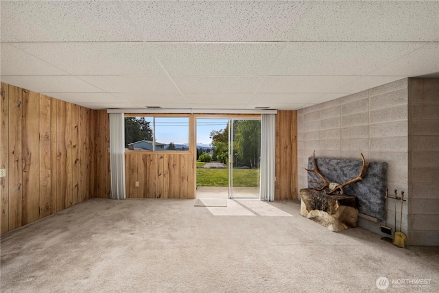 4414 Merlie Ave NE, Bremerton, WA 98310 - unfurnished living room with a drop ceiling, carpet flooring, and wooden walls