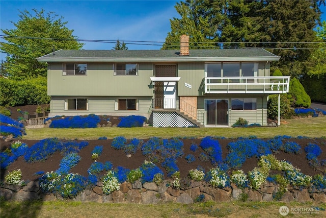 4414 Merlie Ave NE, Bremerton, WA 98310 - back of house with a chimney, a lawn, and a balcony