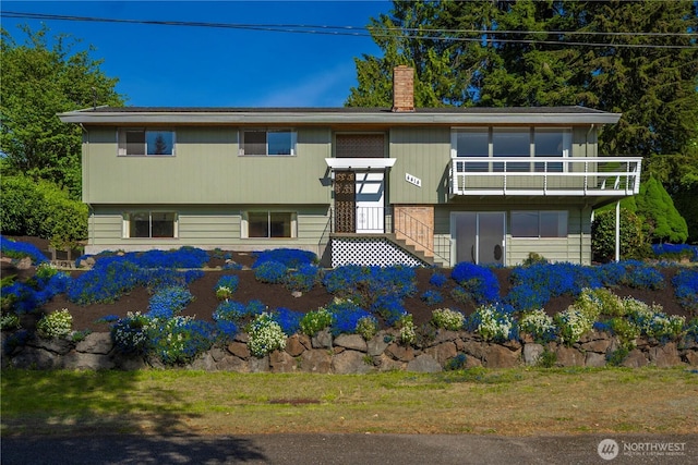 4414 Merlie Ave NE, Bremerton, WA 98310 - bi-level home with a chimney and a balcony