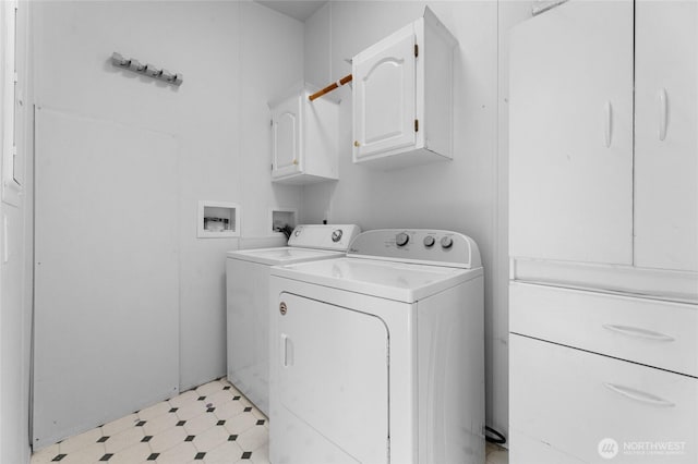 16037 Vail Loop Rd SE, Rainier, WA 98576 - laundry area with cabinet space, light flooring, and washing machine and clothes dryer