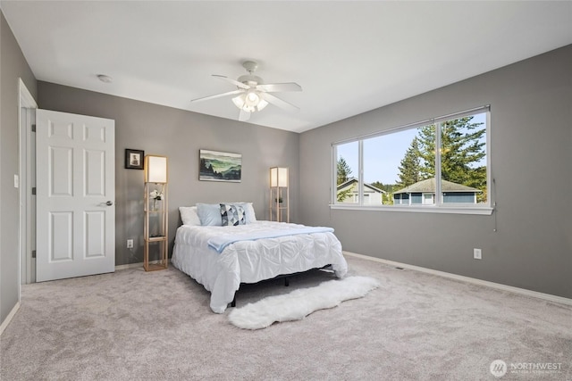 bedroom featuring carpet flooring, baseboards, and ceiling fan