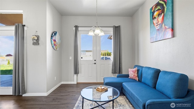 207 Clayton Pl, Mattawa, WA 99349 - living room featuring dark wood-style floors, baseboards, and a chandelier