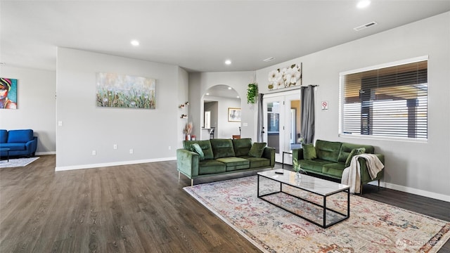 207 Clayton Pl, Mattawa, WA 99349 - living room with arched walkways, dark wood finished floors, recessed lighting, and baseboards
