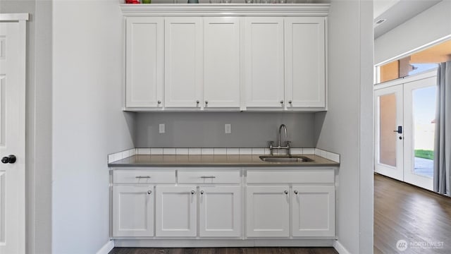 207 Clayton Pl, Mattawa, WA 99349 - kitchen with a sink, white cabinetry, dark wood finished floors, and baseboards