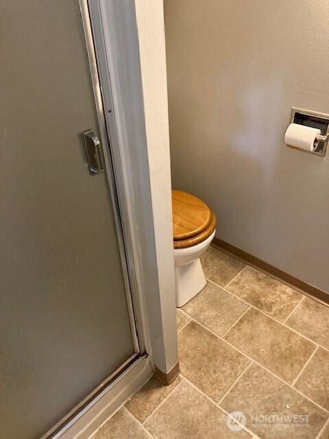 161 N Schoolhouse Hill Rd, Hoodsport, WA 98548 - full bath with a shower stall, toilet, and baseboards