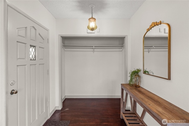 506 G St, Cosmopolis, WA 98537 - corridor with dark wood-style flooring and a textured ceiling