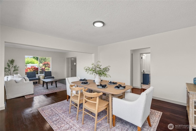 506 G St, Cosmopolis, WA 98537 - dining area featuring dark wood-style flooring and a textured ceiling