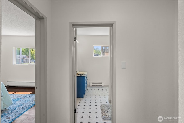 506 G St, Cosmopolis, WA 98537 - hall featuring baseboard heating and plenty of natural light
