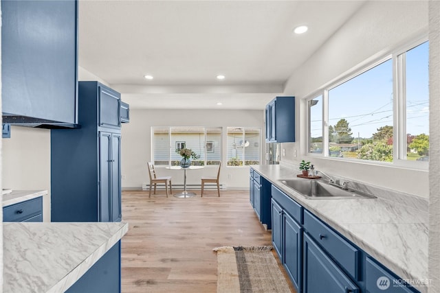 506 G St, Cosmopolis, WA 98537 - kitchen with blue cabinets, recessed lighting, light countertops, light wood-type flooring, and a sink