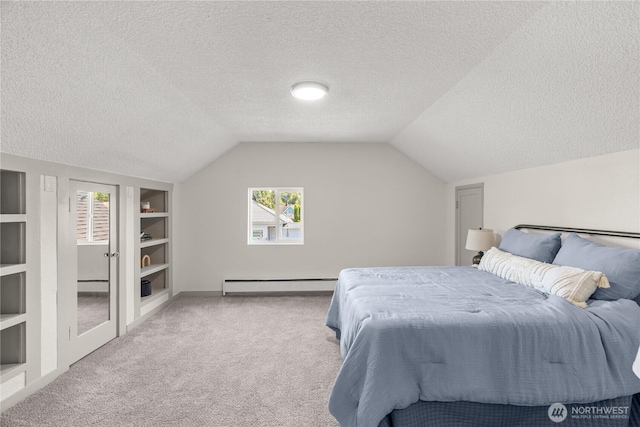 506 G St, Cosmopolis, WA 98537 - carpeted bedroom featuring a baseboard heating unit, a textured ceiling, multiple windows, vaulted ceiling, and baseboards