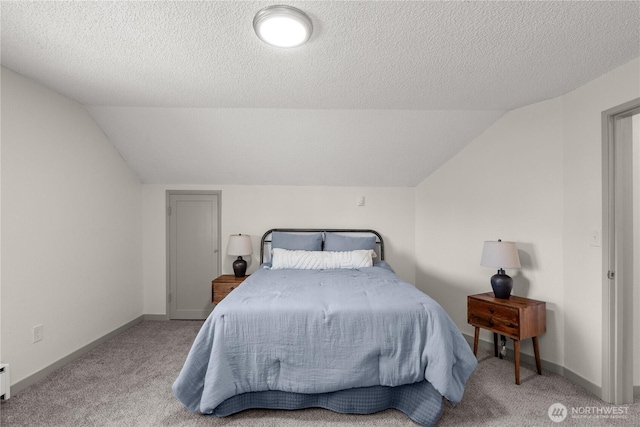 506 G St, Cosmopolis, WA 98537 - bedroom featuring carpet floors, vaulted ceiling, a textured ceiling, and baseboards