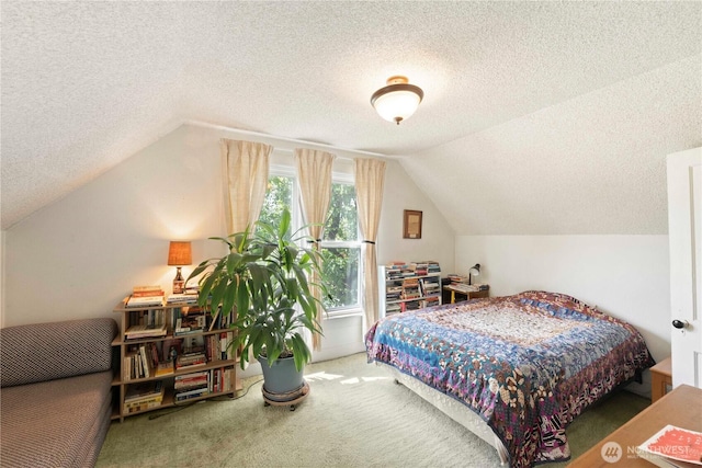 carpeted bedroom featuring a textured ceiling and lofted ceiling