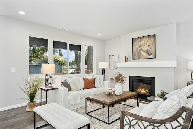 16636 8th Avenue Ct E Unit 05, Spanaway, WA 98387 - living room with wood finished floors, recessed lighting, a glass covered fireplace, and baseboards
