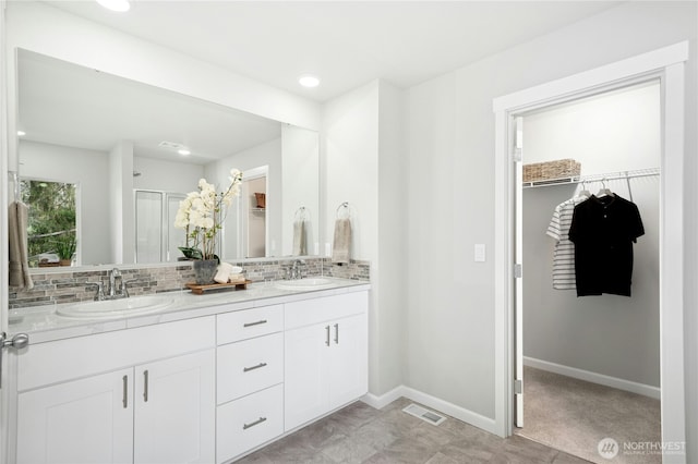 16636 8th Avenue Ct E Unit 05, Spanaway, WA 98387 - full bath featuring tasteful backsplash, a walk in closet, baseboards, double vanity, and recessed lighting