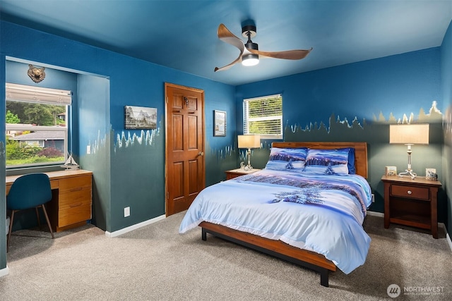 bedroom featuring carpet floors, baseboards, an office area, and ceiling fan