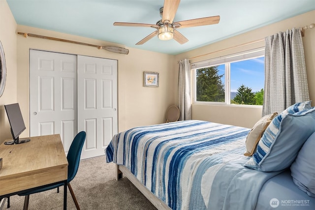 bedroom with carpet flooring, a closet, a ceiling fan, and an office area