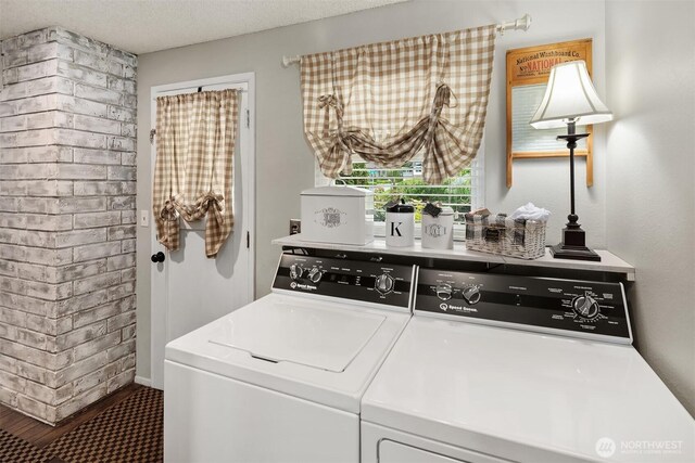 washroom with independent washer and dryer