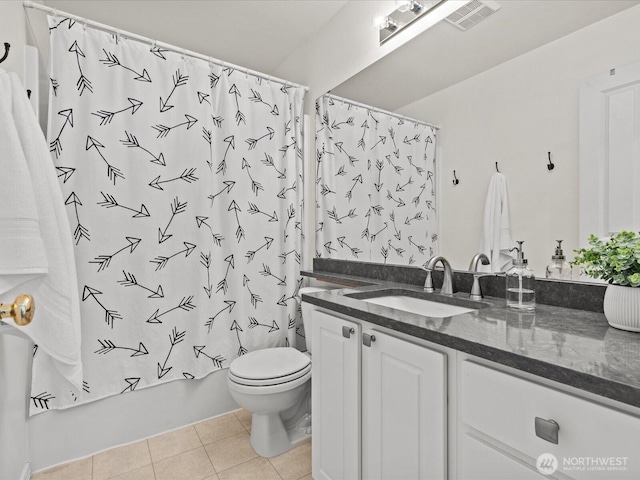 bathroom with toilet, vanity, shower / tub combo with curtain, and tile patterned flooring