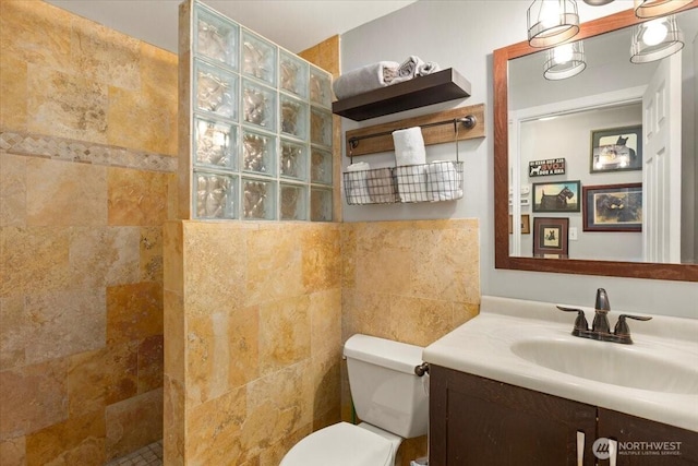 304 Riverview Dr NE, Auburn, WA 98002 - bathroom featuring a walk in shower, toilet, vanity, and tile walls