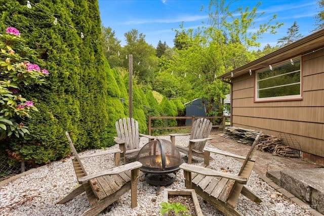 304 Riverview Dr NE, Auburn, WA 98002 - view of patio featuring an outdoor fire pit