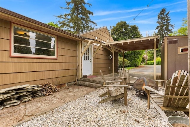 304 Riverview Dr NE, Auburn, WA 98002 - view of patio / terrace featuring an outdoor fire pit