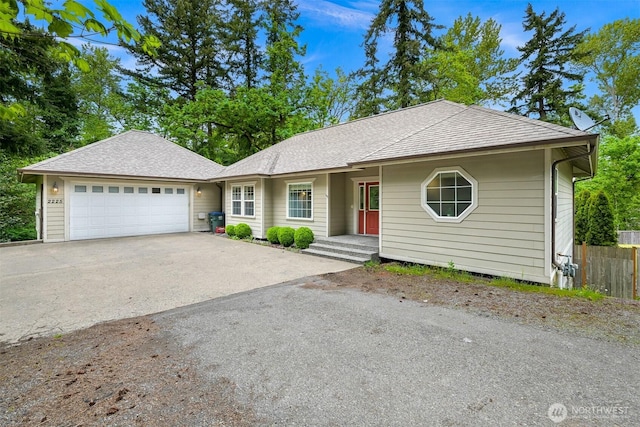2225 Old Lakeway Dr, Bellingham, WA 98229 - single story home with an attached garage, concrete driveway, fence, and roof with shingles