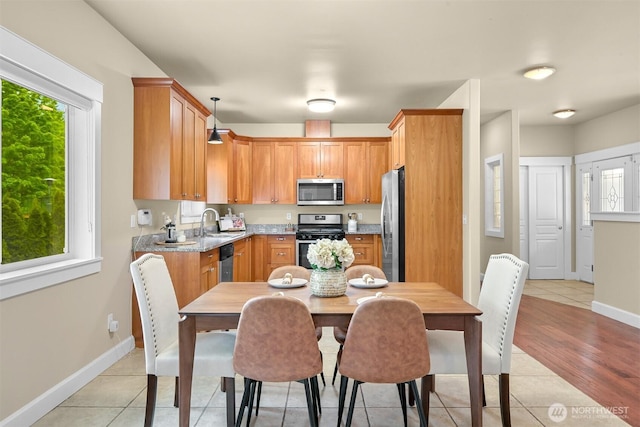 2225 Old Lakeway Dr, Bellingham, WA 98229 - kitchen featuring stainless steel appliances, plenty of natural light, baseboards, and light tile patterned floors