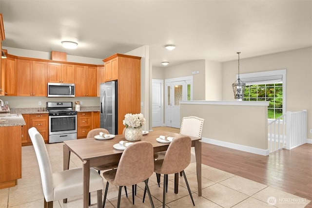 2225 Old Lakeway Dr, Bellingham, WA 98229 - dining area with light wood finished floors and baseboards