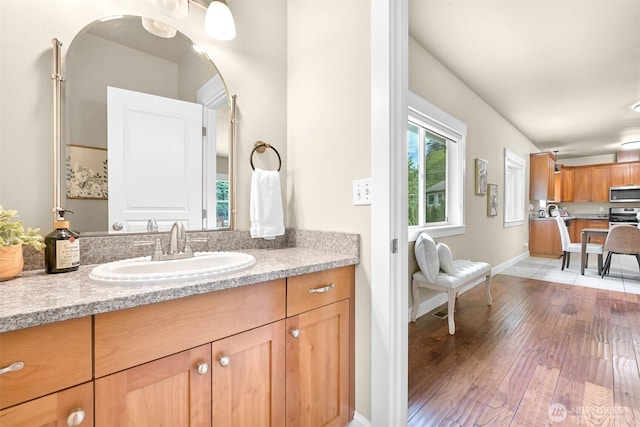 2225 Old Lakeway Dr, Bellingham, WA 98229 - bathroom featuring hardwood / wood-style floors, vanity, and baseboards