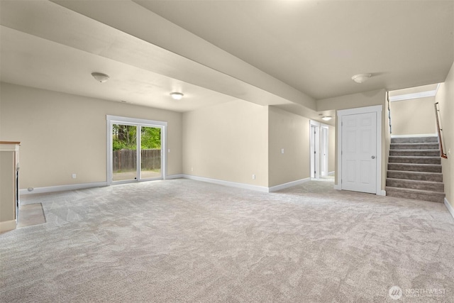 2225 Old Lakeway Dr, Bellingham, WA 98229 - unfurnished living room with light carpet, baseboards, and stairway
