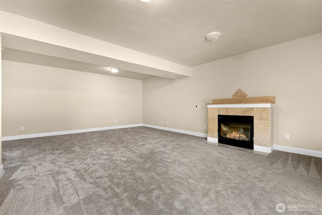 2225 Old Lakeway Dr, Bellingham, WA 98229 - unfurnished living room with carpet floors, a tiled fireplace, and baseboards