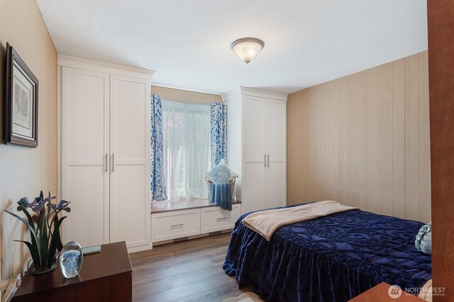 bedroom with wood finished floors