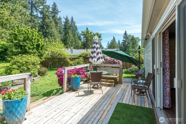 wooden deck with outdoor dining area